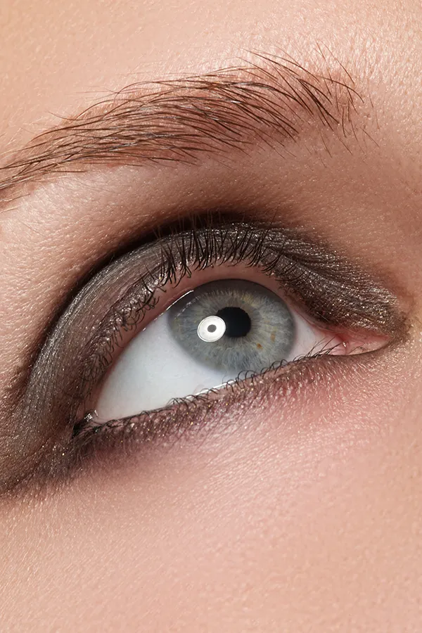 Close-up of a woman's eye looking up. Get Blepharoplasty for Eyelid Contouring from Dr. Hadi Michael Rassael at Millennium Wellness in Bethesda-Chevy Chase.