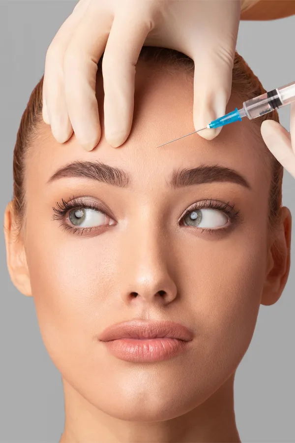 Close up of a woman with receiving a Botox injection in her brow from Dr. Hadi Michael Rassael at Millennium Wellness in Bethesda-Chevy Chase.