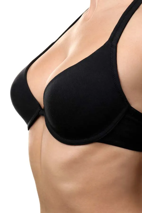 A woman with firm breasts in a black bra. Get breast lift treatment from Dr. Hadi Michael Rassael at Millennium Wellness in Bethesda-Chevy Chase.
