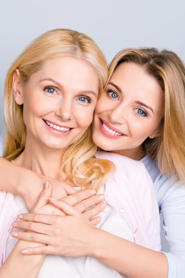 A beautiful older woman and her daughter. Get a Mommy Makeover from Dr. Hadi Michael Rassael at Millennium Wellness in Bethesda-Chevy Chase.