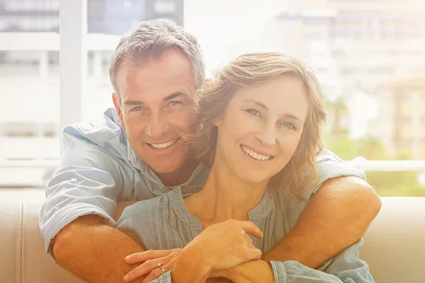 A mature, healthy couple with tight-skinned faces. Get Tempsure Envi RF for skin tightening from Dr. Hadi Michael Rassael at Millennium Wellness in Bethesda-Chevy Chase.